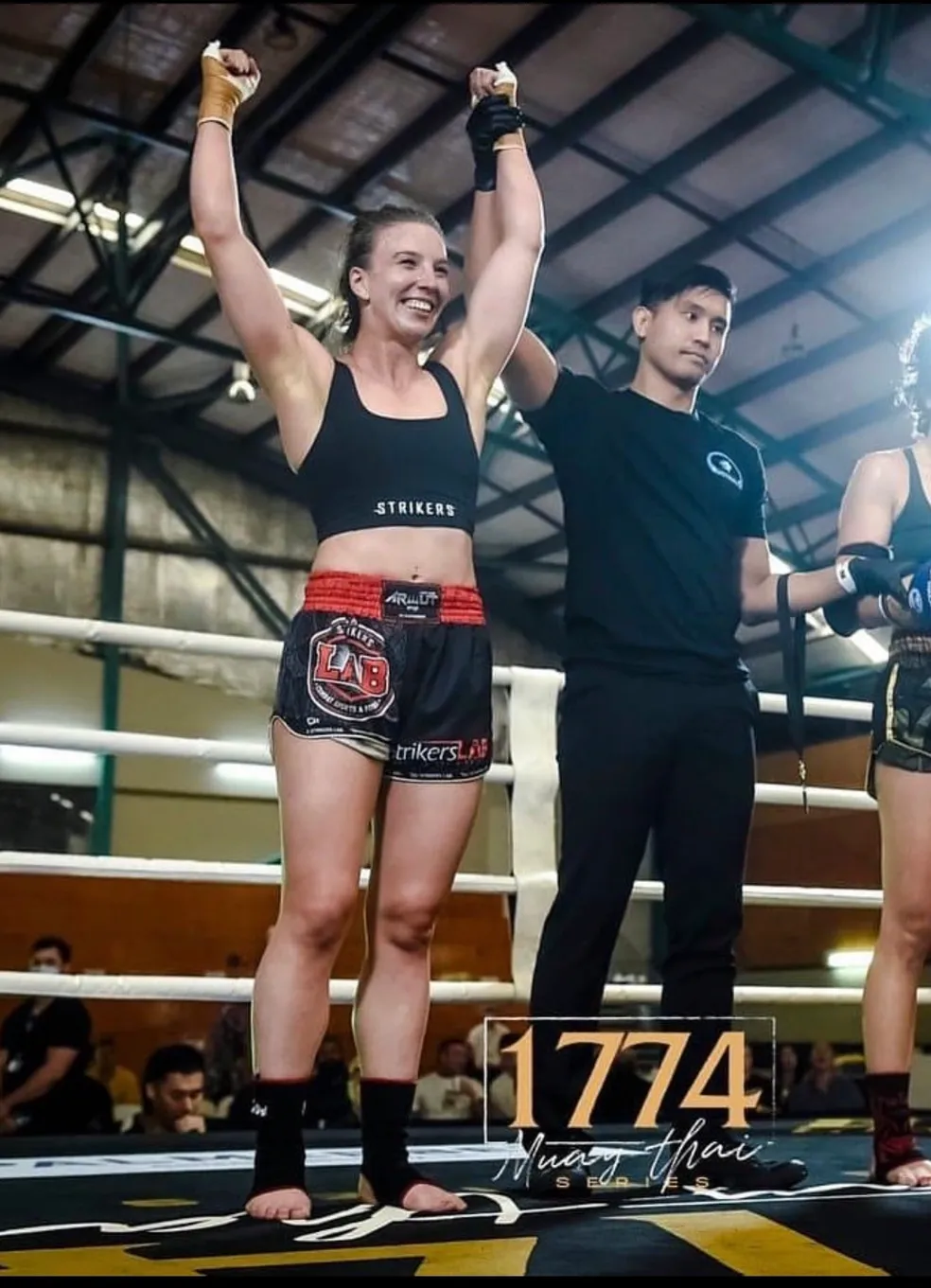 Strikers Lab fighter celebrating victory