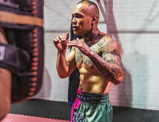 Franz 'Dirty' Sanchez — Head Coach and founder of The Strikers Lab in fighting stance