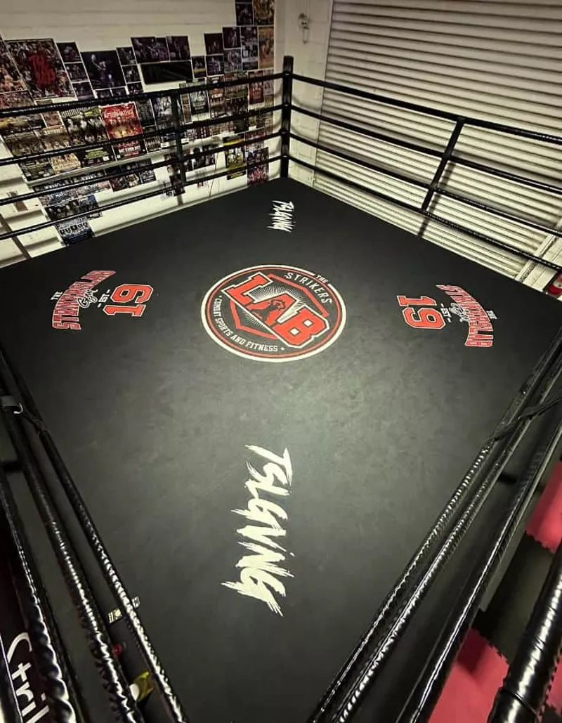 The Strikers Lab branded ring with photo wall